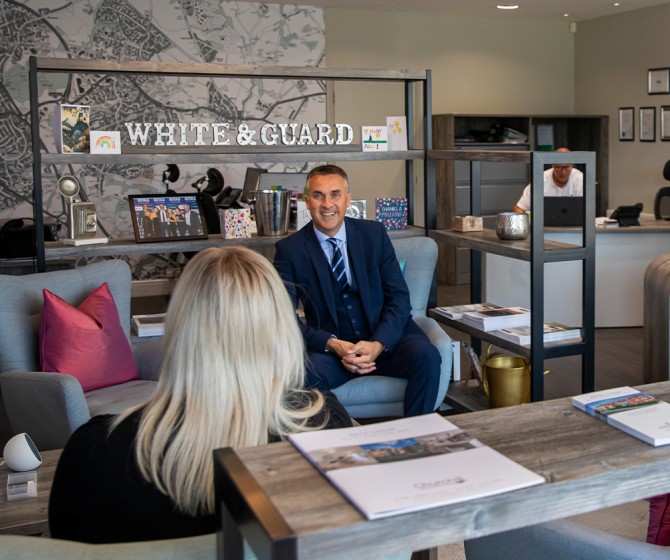 White and Guard team at office